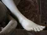 The restored ankle on the Genius of Death statue on the Clement XIII monument